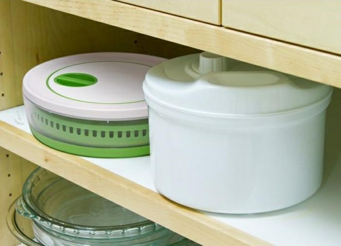 Αποθηκεύστε το κορδόνι σαλάτας του tupperware στο ντουλάπι κουζινών σαλάτας περιστροφής της κουζίνας